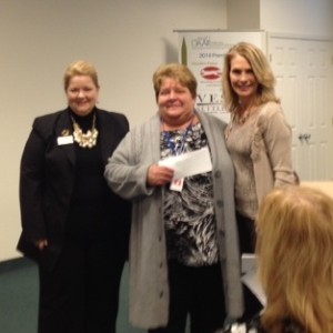 Linda Kimble, Volunteers of America, receives donation from Margaret Halseth, Chair, DAAR CSC and Sue Smith, 2014 DAAR Chair
